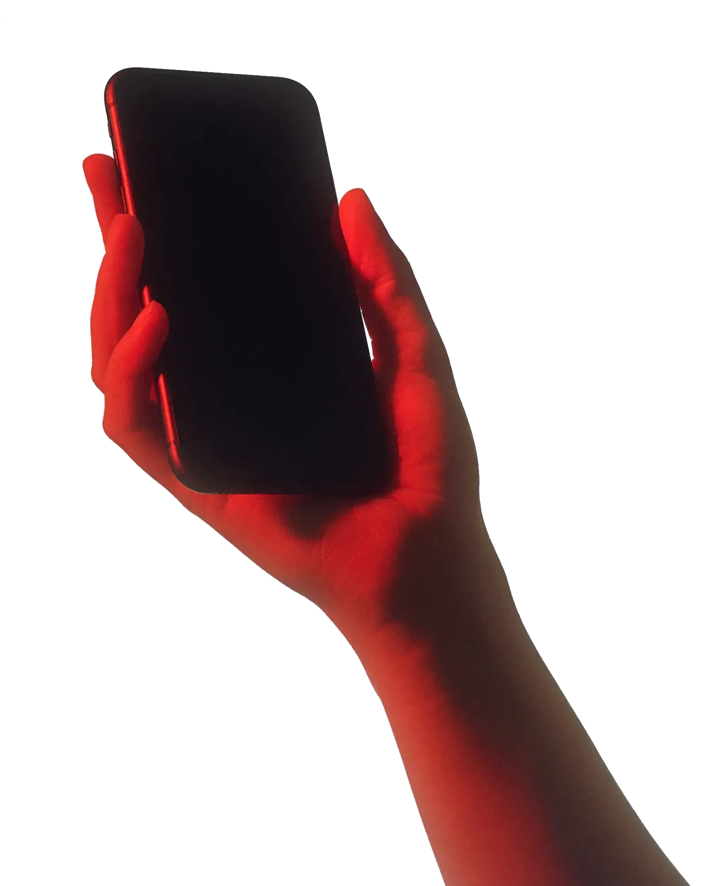 A hand holding a phone, lit red.