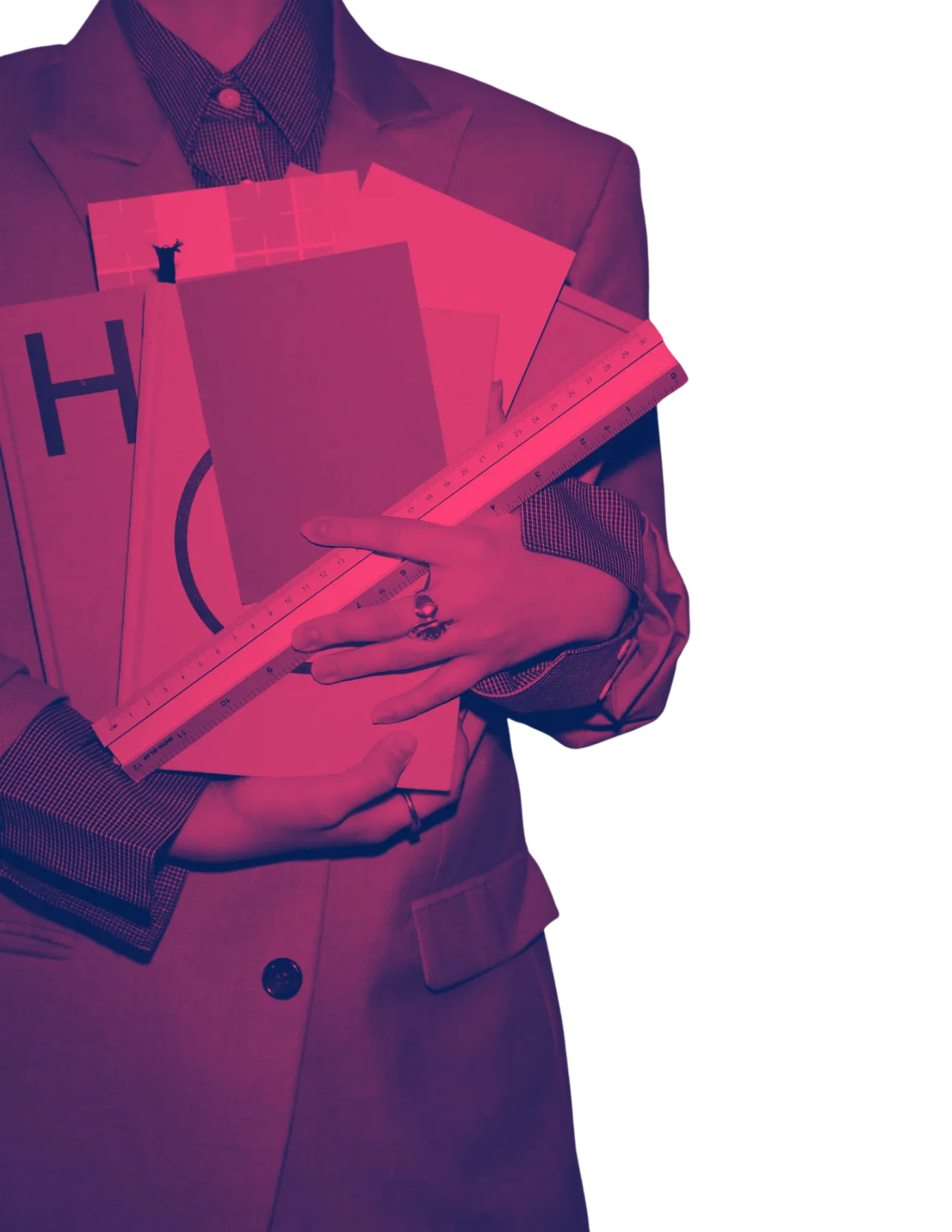 A designer holding books, paper samples and a ruler, lit red.